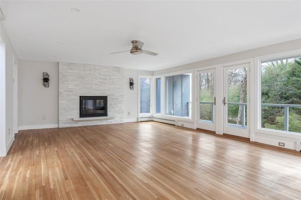 Empty room, Fireplace, Interior, Recessed Lighting, Stone Walls, Wood Texture Flooring