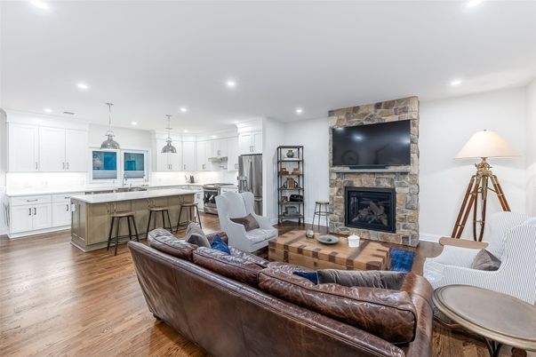Fireplace, Interior, Kitchen, Living room, Pendant Lights, Recessed Lighting, Stainless Steel Appliances, Wood Texture Flooring