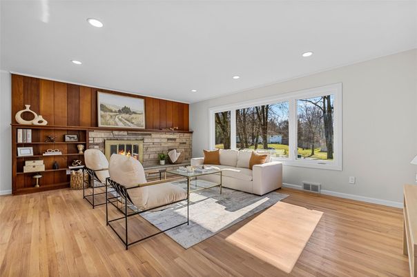 Fireplace, Interior, Living room, Recessed Lighting, Stone Walls, Wood Texture Flooring
