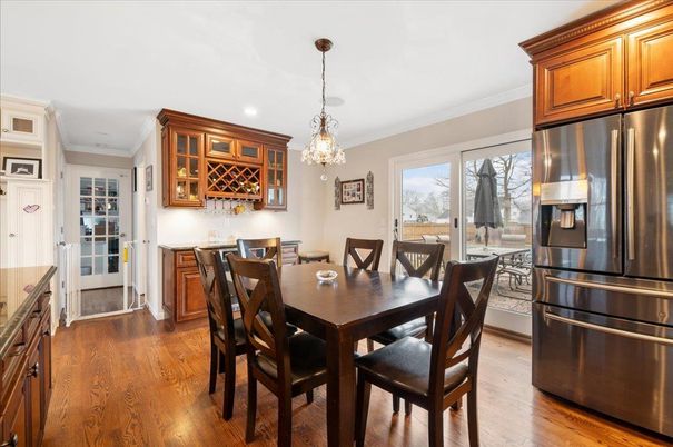 Chandelier, Dining room, Interior, Kitchen, Pendant Lights, Recessed Lighting, Stainless Steel Appliances, Wood Texture Flooring