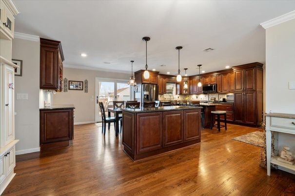 Dining room, Interior, Kitchen, Pendant Lights, Recessed Lighting, Stainless Steel Appliances, Wood Texture Flooring