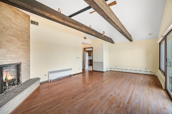 Empty room, Fireplace, Interior, Stone Walls, Wooden Beams, Wood Texture Flooring