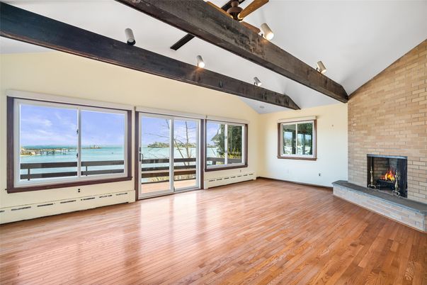 Empty room, Fireplace, Interior, Stone Walls, Wooden Beams, Wood Texture Flooring