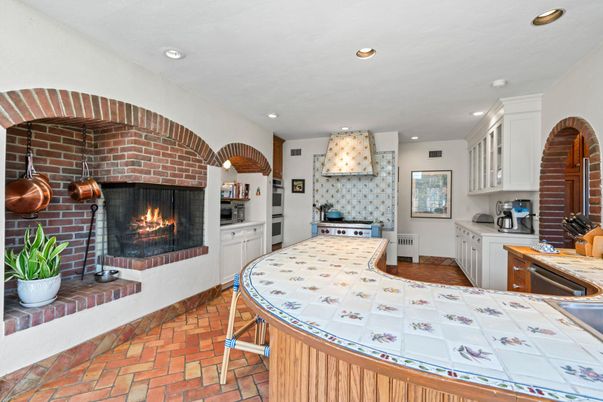 Fireplace, Interior, Kitchen, Recessed Lighting, Stainless Steel Appliances, Stone Walls