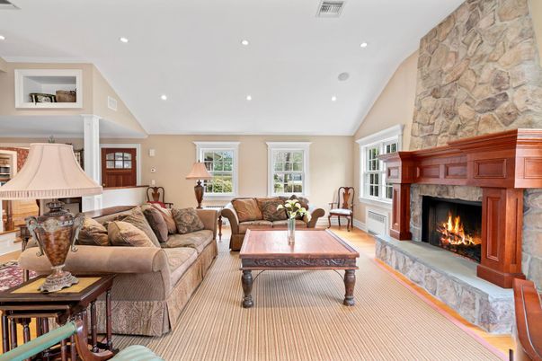 Fireplace, Interior, Living room, Recessed Lighting, Stone Walls, Wood Texture Flooring