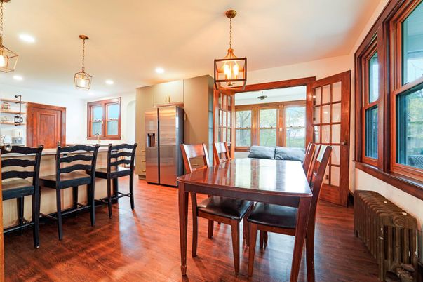 Dining room, Interior, Kitchen, Pendant Lights, Recessed Lighting, Stainless Steel Appliances, Wood Texture Flooring