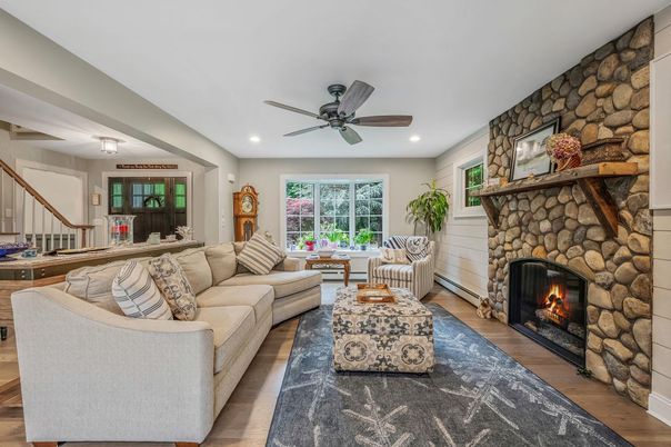 Fireplace, Interior, Living room, Recessed Lighting, Stone Walls, Wood Texture Flooring