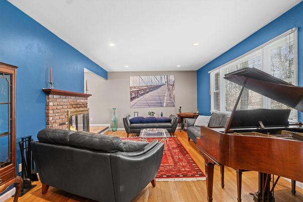 Fireplace, Interior, Living room, Piano, Recessed Lighting, Wood Texture Flooring