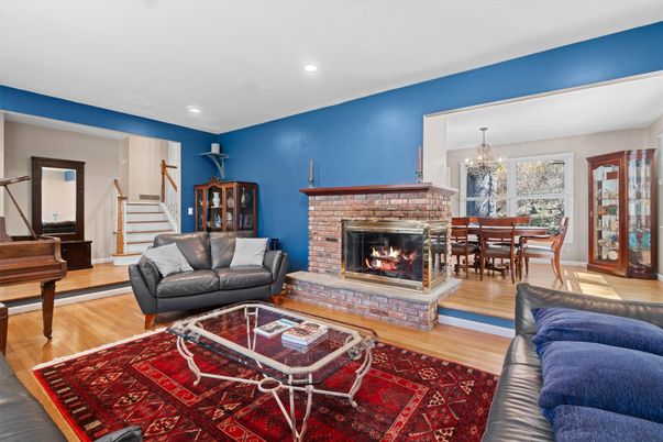 Chandelier, Dining room, Fireplace, Interior, Living room, Piano, Recessed Lighting, Wood Texture Flooring