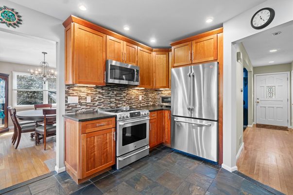 Chandelier, Dining room, Interior, Kitchen, Recessed Lighting, Stainless Steel Appliances, Wood Texture Flooring