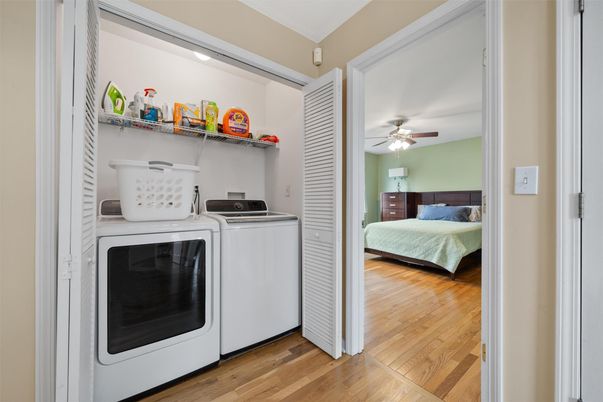 Bedroom, Interior, Recessed Lighting, Utility Closets, Washer, Wood Texture Flooring
