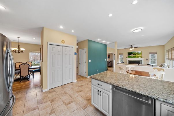 Chandelier, Dining room, Fireplace, Interior, Kitchen, Living room, Recessed Lighting, Wood Texture Flooring