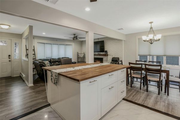 Chandelier, Dining room, Fireplace, Interior, Kitchen, Marble, Recessed Lighting, Stone Walls, Wood Texture Flooring