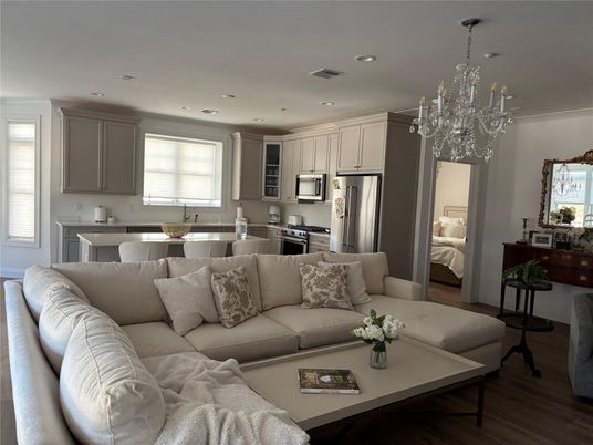 Chandelier, Interior, Kitchen, Living room, Recessed Lighting, Stainless Steel Appliances, Wood Texture Flooring