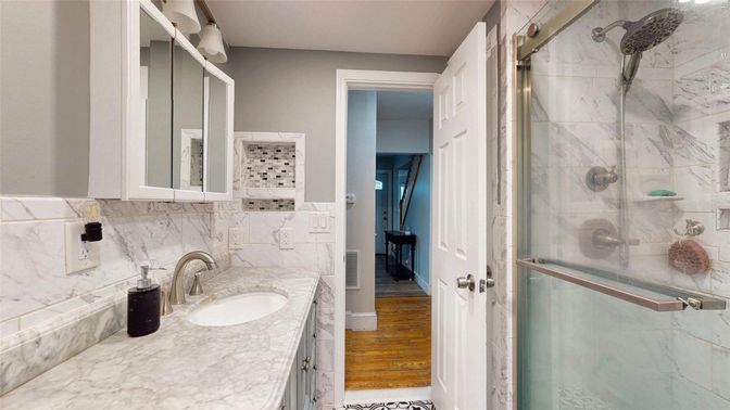 Bathroom, Glass Shower, Interior, Marble Walls, Wood Texture Flooring