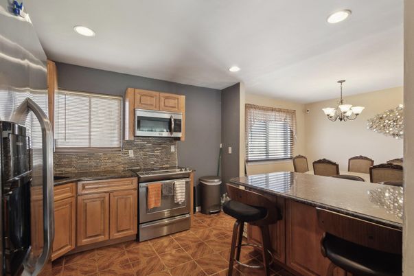 Chandelier, Dining room, Interior, Kitchen, Recessed Lighting, Stainless Steel Appliances
