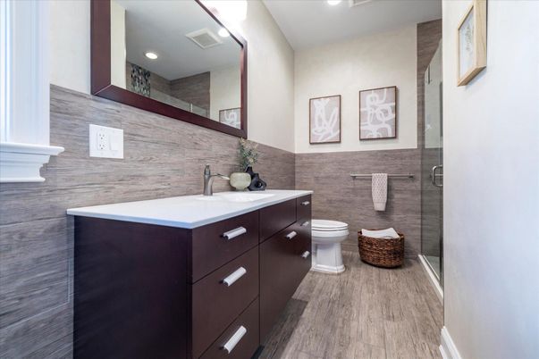 Bathroom, Dual Sink Vanities, Glass Shower, Interior, Recessed Lighting, Wood Texture Flooring