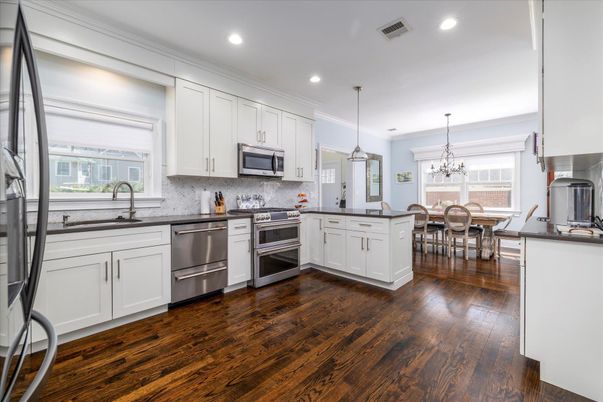Chandelier, Dining room, Interior, Kitchen, Pendant Lights, Recessed Lighting, Stainless Steel Appliances, Wood Texture Flooring