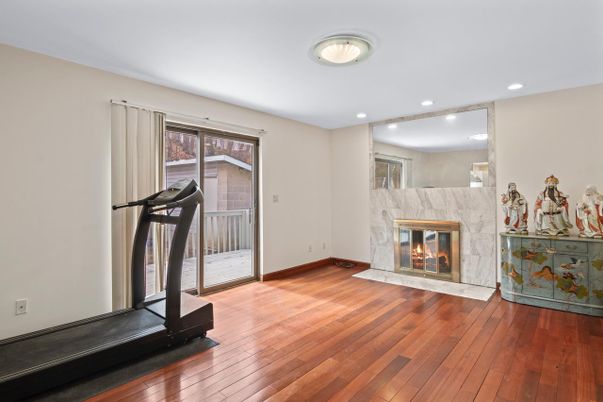 Fireplace, Fitness Equipment, Interior, Recessed Lighting, Wood Texture Flooring