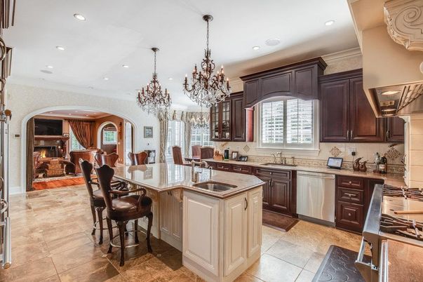 Chandelier, Dining room, Fireplace, Interior, Kitchen, Living room, Recessed Lighting, Stainless Steel Appliances