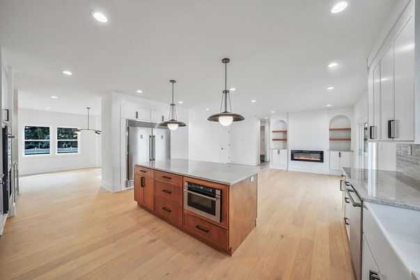 Fireplace, Interior, Kitchen, Pendant Lights, Recessed Lighting, Stainless Steel Appliances, Wood Texture Flooring