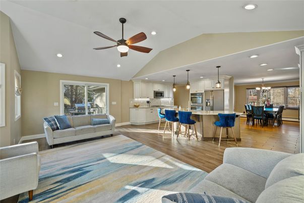 Chandelier, Dining room, Interior, Kitchen, Living room, Pendant Lights, Recessed Lighting, Stainless Steel Appliances, Wood Texture Flooring