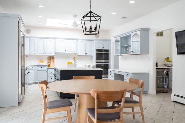 Dining room, Interior, Kitchen, Pendant Lights, Recessed Lighting, Stainless Steel Appliances, Wood Texture Flooring