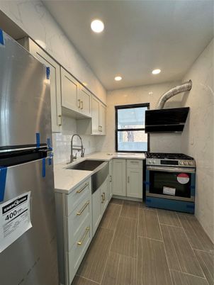 Interior, Kitchen, Marble Walls, Recessed Lighting, Stainless Steel Appliances