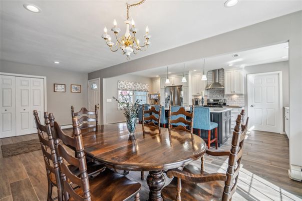 Chandelier, Dining room, Interior, Kitchen, Recessed Lighting, Stainless Steel Appliances, Wood Texture Flooring