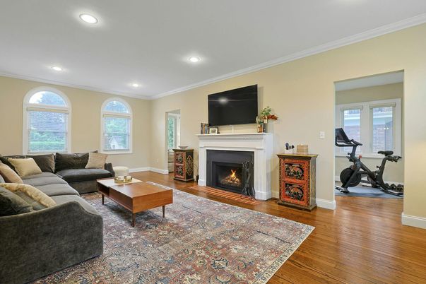 Fireplace, Fitness Equipment, Interior, Living room, Recessed Lighting, Wood Texture Flooring