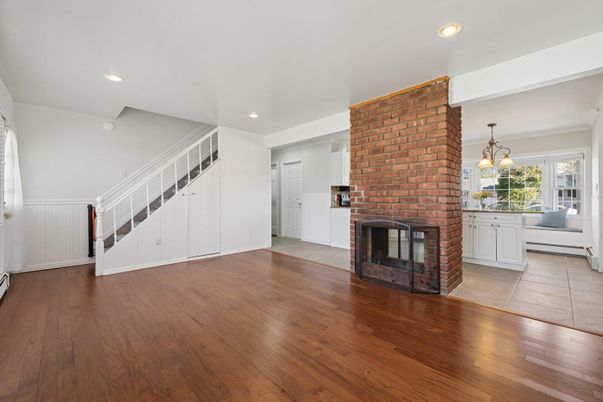 Empty room, Fireplace, Interior, Kitchen, Pendant Lights, Recessed Lighting, Stone Walls, Wood Texture Flooring
