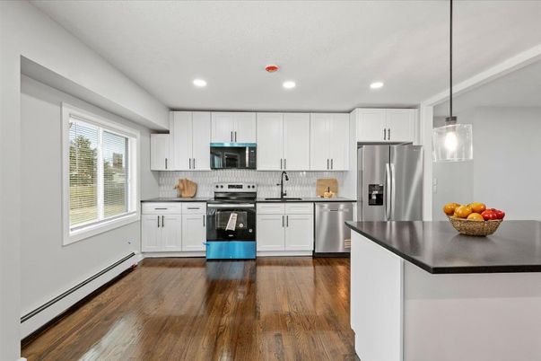 Interior, Kitchen, Pendant Lights, Recessed Lighting, Stainless Steel Appliances, Wood Texture Flooring