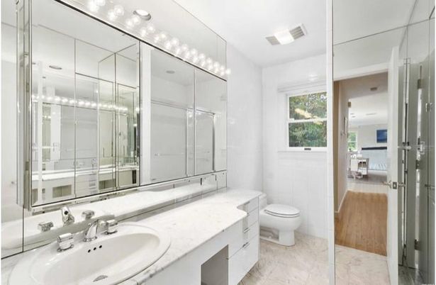 Bathroom, Dual Sink Vanities, Glass Shower, Interior, Marble, Recessed Lighting, Wood Texture Flooring