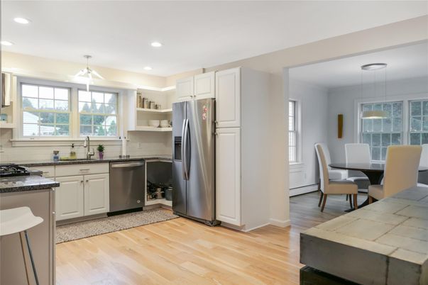 Dining room, Interior, Kitchen, Pendant Lights, Recessed Lighting, Stainless Steel Appliances, Wood Texture Flooring