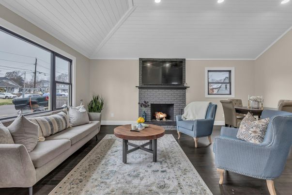 Dining room, Fireplace, Interior, Living room, Recessed Lighting, Wood Texture Flooring