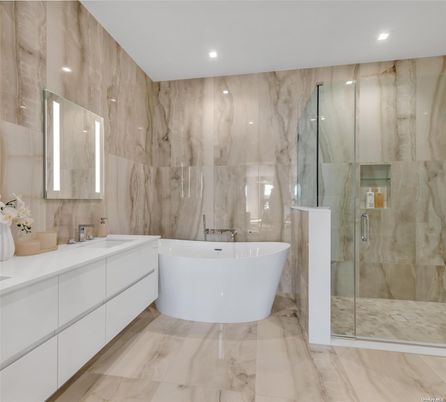 Bathroom, Dual Sink Vanities, Free Standing Baths, Glass Shower, Interior, Marble, Marble Walls, Recessed Lighting