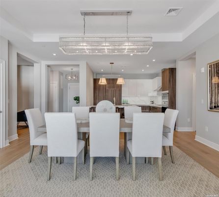Chandelier, Dining room, Interior, Kitchen, Pendant Lights, Recessed Lighting, Stainless Steel Appliances, Wood Texture Flooring