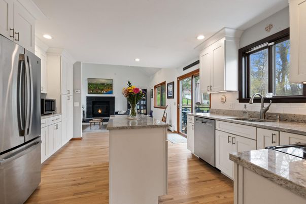 Fireplace, Interior, Kitchen, Recessed Lighting, Stainless Steel Appliances, Wood Texture Flooring