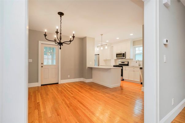 Chandelier, Interior, Kitchen, Pendant Lights, Recessed Lighting, Stainless Steel Appliances, Wood Texture Flooring