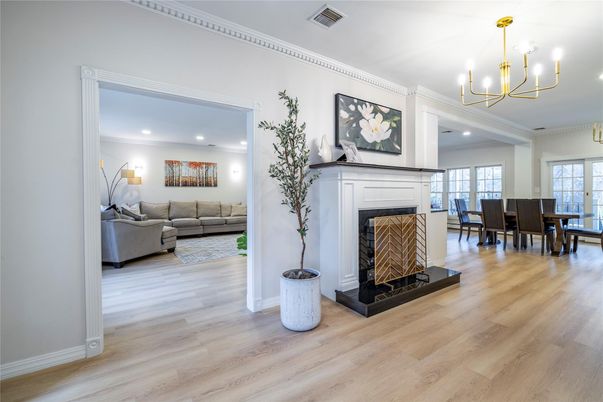 Chandelier, Dining room, Fireplace, Interior, Living room, Recessed Lighting, Wood Texture Flooring