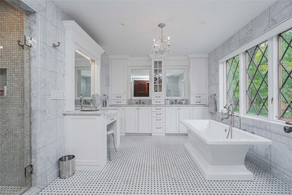 Bathroom, Chandelier, Dual Sink Vanities, Free Standing Baths, Glass Shower, Interior, Marble Walls, Recessed Lighting