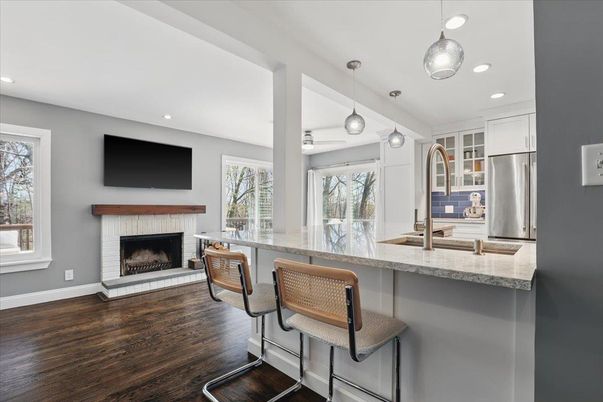 Fireplace, Interior, Kitchen, Pendant Lights, Recessed Lighting, Stainless Steel Appliances, Wood Texture Flooring
