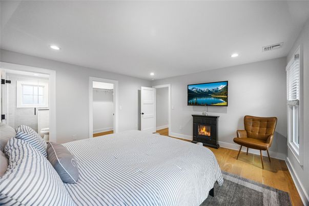 Bedroom, Fireplace, Interior, Recessed Lighting, Wood Texture Flooring