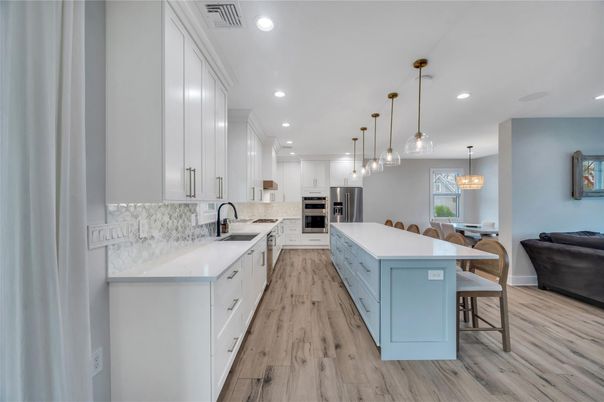 Dining room, Interior, Kitchen, Pendant Lights, Recessed Lighting, Stainless Steel Appliances, Wood Texture Flooring