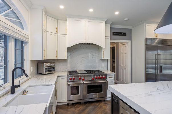 Interior, Kitchen, Marble Walls, Recessed Lighting, Stainless Steel Appliances, Wood Texture Flooring