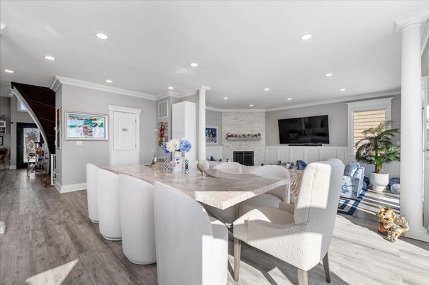 Dining room, Fireplace, Interior, Living room, Recessed Lighting, Wood Texture Flooring