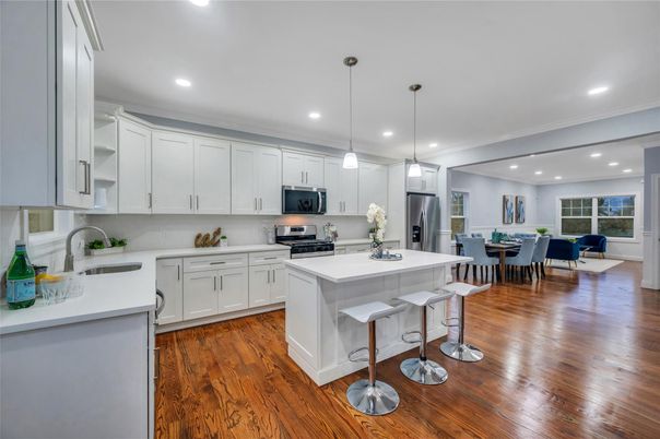 Dining room, Interior, Kitchen, Pendant Lights, Recessed Lighting, Stainless Steel Appliances, Wood Texture Flooring