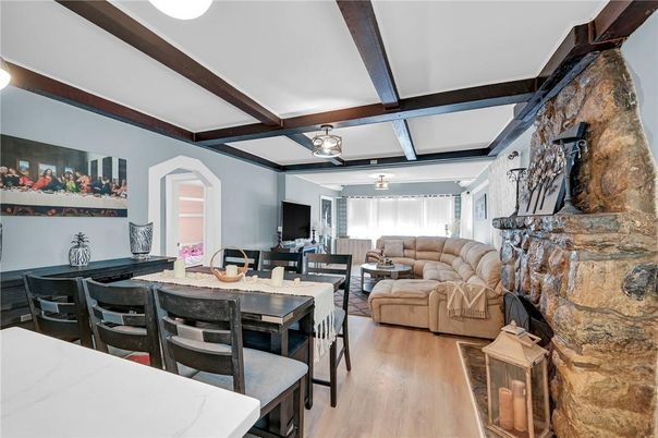 Dining room, Fireplace, Interior, Living room, Stone Walls, Wooden Beams, Wood Texture Flooring