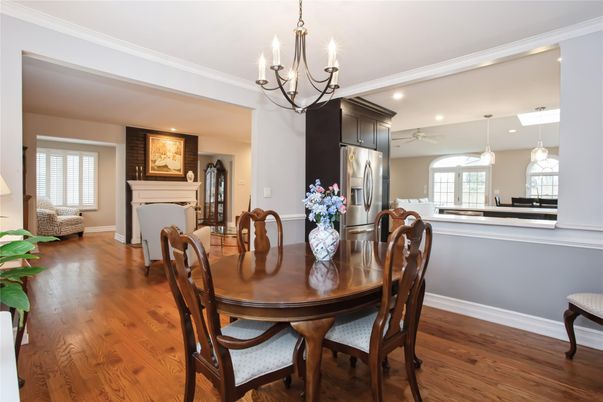 Chandelier, Dining room, Fireplace, Interior, Kitchen, Pendant Lights, Recessed Lighting, Stainless Steel Appliances, Wood Texture Flooring