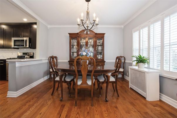 Chandelier, Dining room, Interior, Kitchen, Recessed Lighting, Stainless Steel Appliances, Wood Texture Flooring